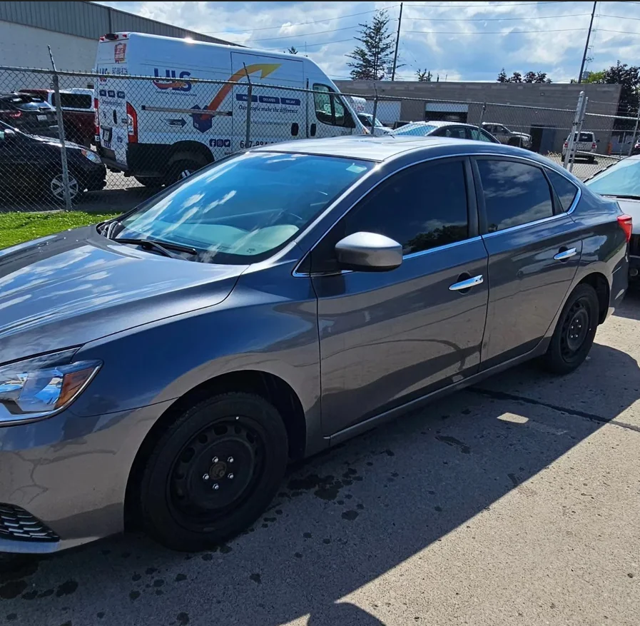 Grey sedan at DY Autobody & Paint